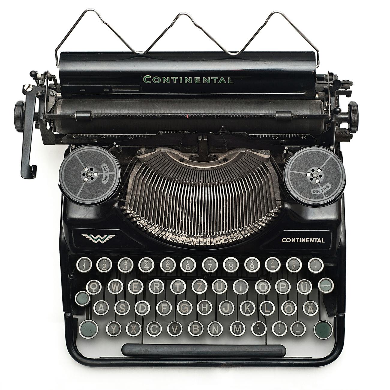 black continental typewriter on white surface